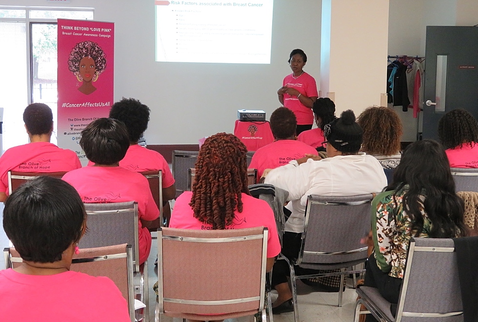 Blessing Bassey-Archibong – at one time a student in McMaster researcher Juliet Daniels' lab, and now a McMaster postdoctoral student – gives a breast cancer awareness talk at the inaugural Think Beyond Love Pink workshop in October 2016. The workshop, and others like it, are part of community partnership led by Daniel and Leila Springer of the Olive Branch of Hope, this year’s recipients of the President’s Award for Community Engaged research.