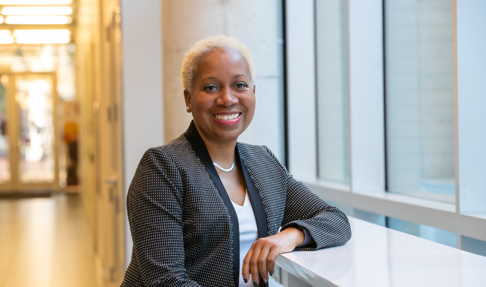 Dr. Juliet Daniel sits in the lobby of LR Wilson Hall at McMaster University